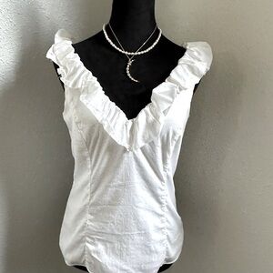 White sleeveless ruffle blouse from WHBM